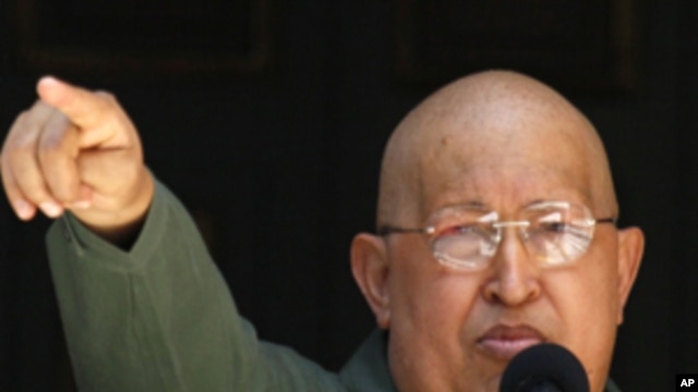 Venezuela's President Hugo Chavez gestures as he delivers a speech to employees of the government palace during a ceremony in Caracas,  October 1, 2011.