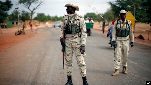 Malian soldiers man a checkpoint on the Gao road outside Sevare, some 620 kilometers (385 miles) north of Mali's capital Bamako,  Jan. 27, 2013.
