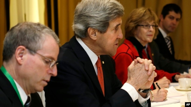 U.S. Secretary of State John Kerry, second from left,  meets with leaders of the Syrian Opposition Coalition at the Hotel Excelsior in Rome, February 28, 2013.