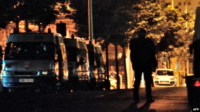 French anti-riot police vehicles are parked in the northern French city of Amiens two days after a district of the city was left devastated by riots, August 15, 2012.