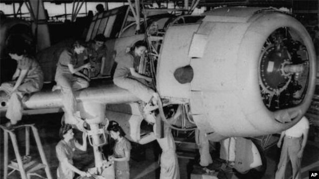 A crew of women work on the final assembly of a bomber in Tennessee on Aug. 31, 1942