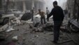 Residents inspect bodies at a site damaged from what activists said was an airstrike by forces loyal to Syria's President Bashar al-Assad on the main field hospital in the town of Douma, Syria, October 29, 2015.
