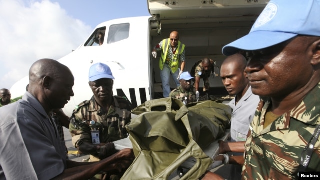 The bodies of the United Nations peacekeepers killed in western Ivory coast near the Liberia border arrive in Abidjan June 9, 2012. 