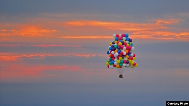 Jonathan Trappe is seen flying is cluster balloon ship on September 12, 2013. (Paul Cyr Barcroft media)