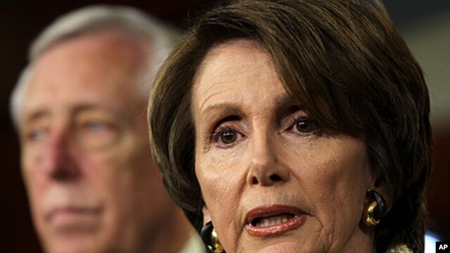 U.S. House Minority Leader Rep. Nancy Pelosi (R) speaks as House Minority Whip Steny Hoyer (L) listens during a news conference on Capitol Hill in Washington, DC, December 16, 2011.