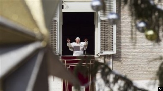 Pope Benedict XVI delivers his blessing during the Angelus noon prayer he celebrated from the window of his studio overlooking St. Peter's square at the Vatican, 26 Dec 2010.
