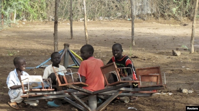 Sudanese children play with a broken playground chair in Kakuma Refugee camp, which houses over 60,000 refugees in North western Kenya. (File Photo)