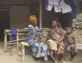 An expectant mother consults with a traditional birth attendant in Bonthe District. Most are not able to detect a problem pregnancy, or intervene in an obstetric emergency.