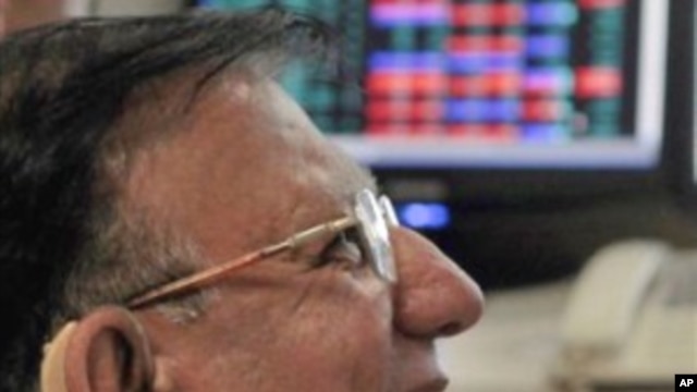 An Indian stock broker reacts while looking at Sensex stock index at brokerage firm in Mumbai, India, 13 Sep 2010