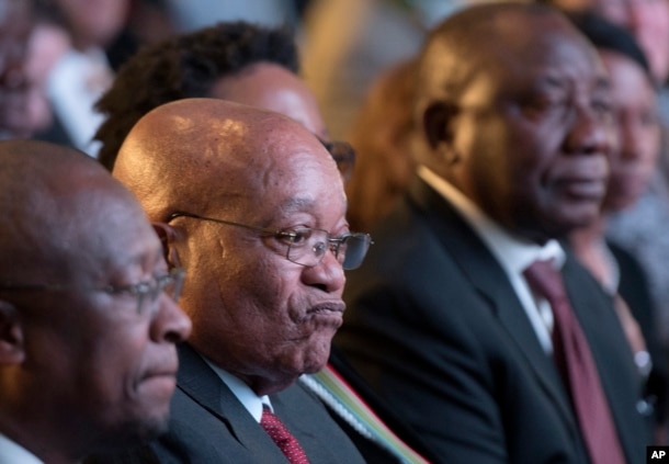 FILE - President Jacob Zuma (C) and deputy president Cyril Ramaphosa (R) attend the declaration announcement of the municipal elections in Pretoria, South Africa, Aug. 6, 2016. This was the worst-ever election showing for South Africa's ruling party.