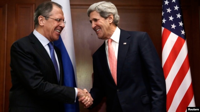 U.S. Secretary of State John Kerry (R) shakes hands with Russian Foreign Minister Sergey Lavrov at the start of their meeting in Berlin, February 26, 2013. 