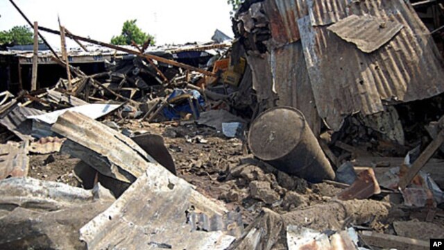 Shattered remnants are seen at the site of a bomb blast at a bar in the Nigerian city of Maiduguri, July 3, 2011