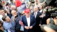 FILE - Republican presidential candidate Donald Trump, center, greets supporter after speaking at a campaign event in Los Angeles, Sept. 15, 2015.