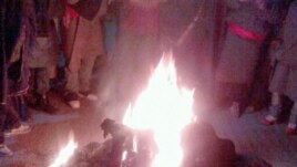 The 23-year-old Tibetan man, Tsepak Kyap, is seen here engulfed in flames near a bus stop in the township of Sankok, Sangchu county, in China’s northwestern Gansu province. This photo was sent into to the VOA Tibetan Service.