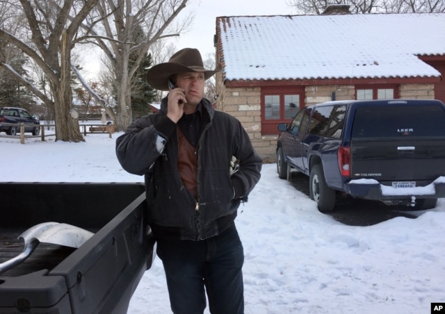 Ryan Bundy talks on the phone at the Malheur National Wildlife Refuge near Burns, Ore., Sunday, Jan. 3, 2016.