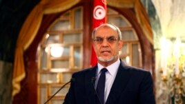 Tunisia's Prime Minister Hamadi Jebali speaks as he announces his resignation during a news conference in Tunis, February 19, 2013.
