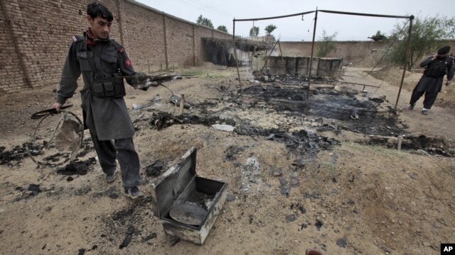 Pakistani paramilitary soldiers check the site of an attack by militants in the town of Matni, near Peshawar, Pakistan, Oct. 15, 2012. 