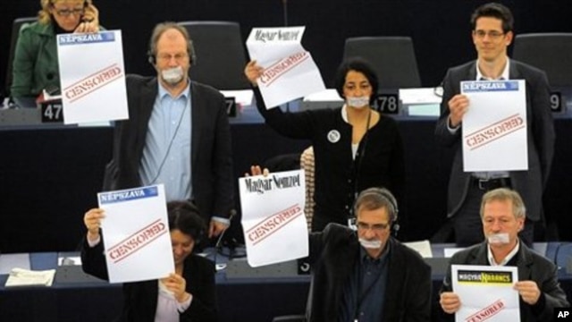 Some EU legislators covered their mouth with duct tape and held banners protesting Hungary's controversial media law, as that country's PM Viktor Orban spoke at the European Parliament in Strasbourg, Jan. 19 2011
