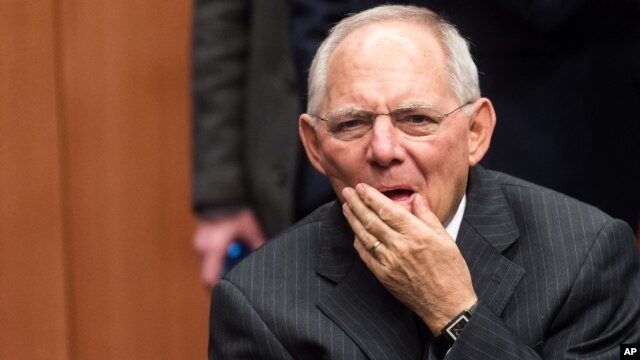 Germany's Finance Minister Wolfgang Schauble arrives for the Eurogroup finance ministers meeting at the EU Council building in Brussels, Feb. 11, 2016. 