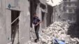 This image made from video released by Qasion News Agency, a media opposition platform that relies on a network of activists on the ground, on Friday, April 29, 2016 shows people scrambling through rubble following airstrikes in Aleppo, Syria. 