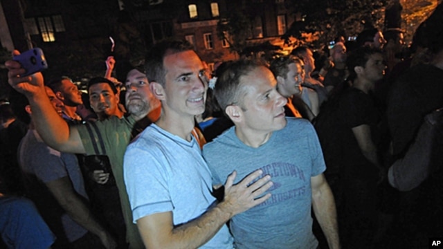 Carl Bazil and Eric Price celebrate in Manhattan's west village following the passing of the same-sex marriage bill by the New York Senate, June 24, 2011