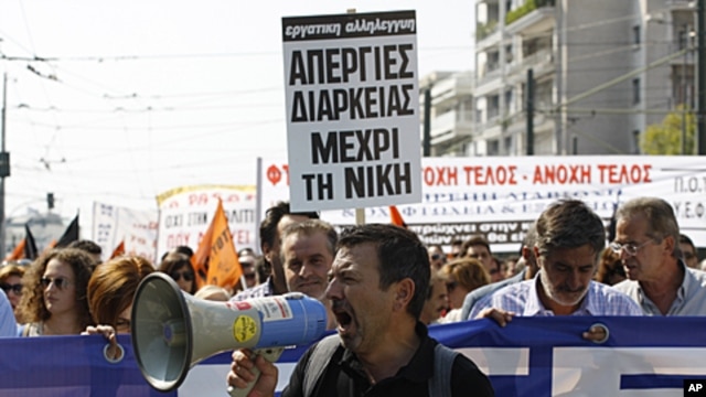 Protesters shout slogans during demonstration in Athens, Oct. 5, 2011.