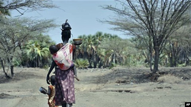 A mother and her children walk along a path in central Turkana, Kenya, August 30, 2011.