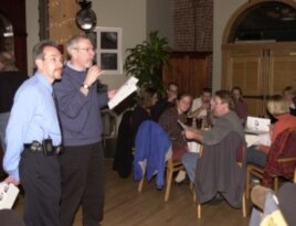 Professor John Cohen, with guest lecturer Dan Bessesen, at a Mini Med School gathering to discuss the science of medicine with members of the community.