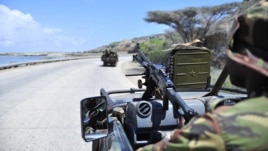 Soldiers patrol the seaport in Somalia's southern port city of Kismayo, November 29, 2012.