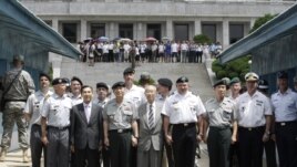 U.S. General James D. Thurman, commander of the U.S. Forces Korea (4th R), poses with the Neutral Nations Supervisory Commission, United Nations Forces and South Korean officers.