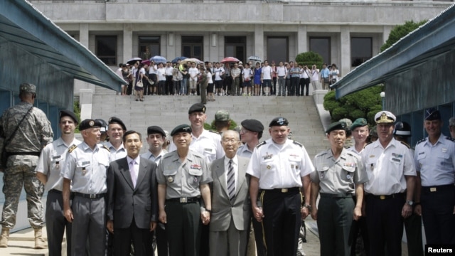 U.S. General James D. Thurman, commander of the U.S. Forces Korea (4th R), poses with the Neutral Nations Supervisory Commission, United Nations Forces and South Korean officers.