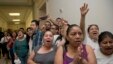 People shout out against the Strengthen and Fortify Enforcement Act in the hall outside the House Judiciary Committee hearing on Capitol Hill in Washington, June 18, 2013. 