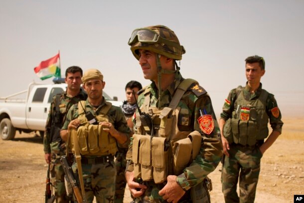 Lt. Col. Arshad Hussein with the 1st Zerevani Brigade at a small outpost outside the village of Qarqashah, Iraq, Aug. 15, 2016.