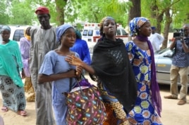 Schoolgirls who escaped Boko Haram rebels prepare to meet with officials in Maiduguri, Nigeria, June 2, 2014.