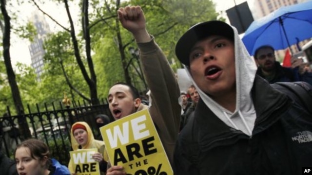 Occupy Wall Street protesters march to the Bank of America headquarters in New York, May 1, 2012. 