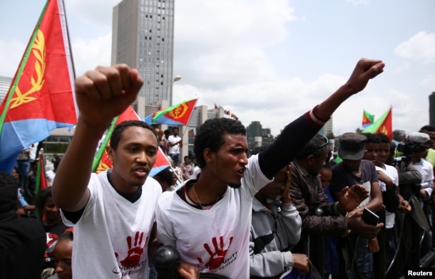 FILE - Eritrean refugees chant slogans as they participate in a demonstration in support of a U.N. human rights report accusing Eritrean leaders of crimes against humanity in front of the Africa Union headquarters in Ethiopia's capital Addis Ababa, June 2016.