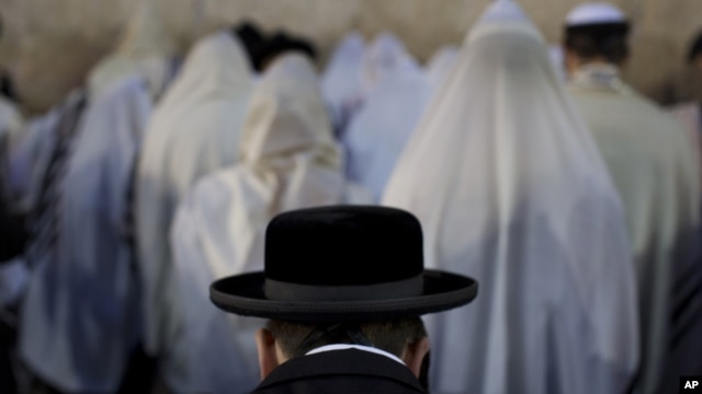 Ultra-Orthodox Jews pray at the Western Wall in Jerusalem's Old City, before the start the holiday of Rosh Hashana, Sept. 16, 2012.