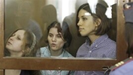 Members of punk group Pussy Riot on trial in glass-enclosed courtroom cage, Moscow, July 30, 2012.