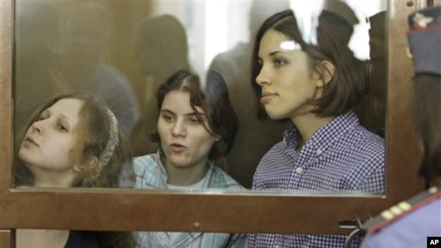 Members of punk group Pussy Riot on trial in glass-enclosed courtroom cage, Moscow, July 30, 2012.