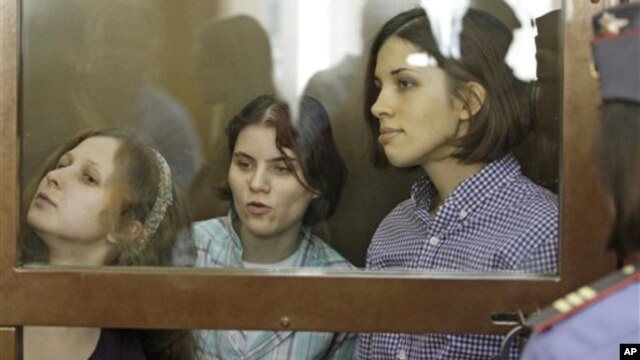Members of punk group Pussy Riot on trial in glass-enclosed courtroom cage, Moscow, July 30, 2012.