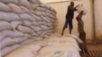 Men transport food aid intended for recently liberated portions of the country, near Sevare, Mali, Feb. 4, 2013.