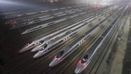 CRH380 (China Railway High-speed) Harmony bullet trains are seen at a high-speed train maintenance base in Wuhan, Hubei province, early December 25, 2012. 
