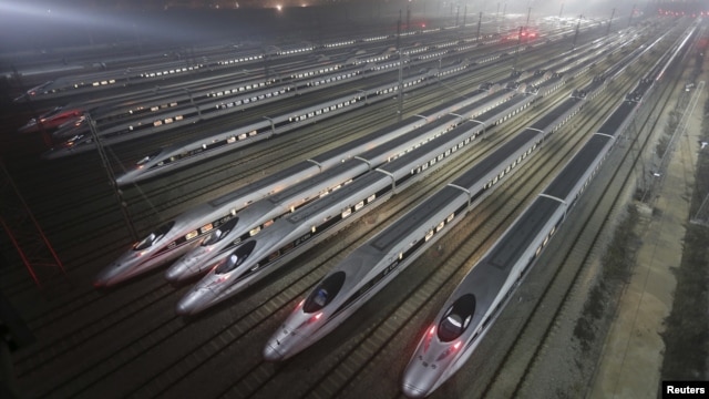 CRH380 (China Railway High-speed) Harmony bullet trains are seen at a high-speed train maintenance base in Wuhan, Hubei province, early December 25, 2012. 
