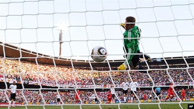 Germany's goalkeeper Manuel Neuer eyes the ball shot by England player Frank Lampard before goal was disallowed during 2010 World Cup round of 16 soccer match, 27 Jun 2010