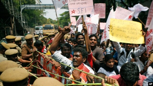 India Tamil activists try to push past a barricade during a protest against alleged wartime abuses by Sri Lanka in Chennai, India.