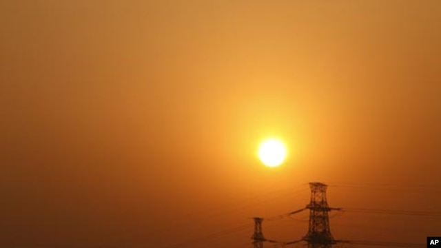 Electricity pylons in Beijing. China has invested $30 billion to boost energy conservation and curb greenhouse gas emissions in the past five years.