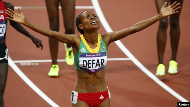 Ethiopia's Meseret Defar celebrates after winning the women's 5,000-meter final during the London 2012 Olympic Games at the Olympic Stadium, August 10, 2012.