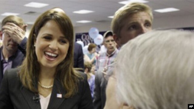 Delaware Republican Senate nominee Christine O'Donnell talks to supporters before the start of a campaign rally, Thursday, Oct. 28, 2010, in Dover, Del.