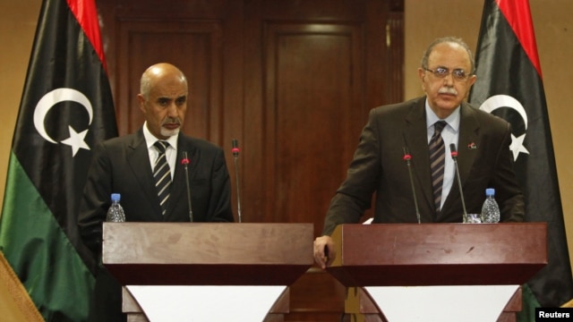 Libya's Prime Minister Abdurrahim El-Keib (R) and Head of the national assembly Mohammed Magarief attend a news conference in Tripoli, September 12, 2012.