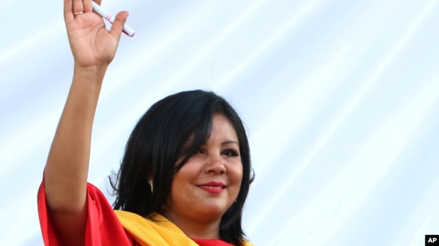 Gisela Mota waves during her swearing in ceremony as mayor of Temixco, Morelos State, Mexico, Jan. 1, 2016. 